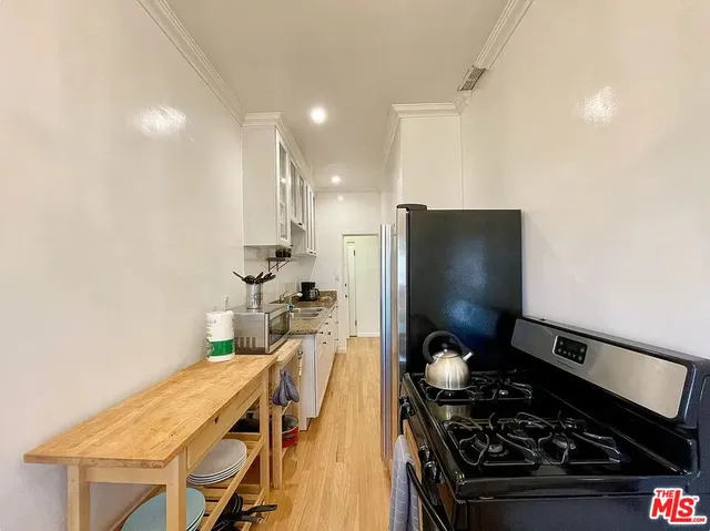 a kitchen with a table and chairs