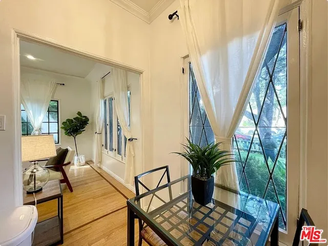 a view of a living room and entryway