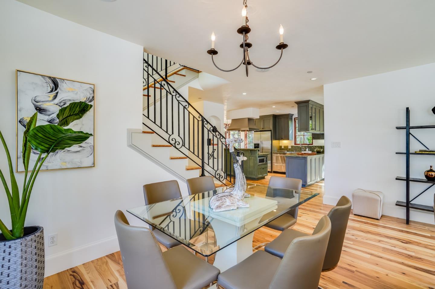 720 Edgewood Road San Mateo, CA 94402 - Photo 11 of 56 a view of a dining room with furniture a potted plant and wooden floor