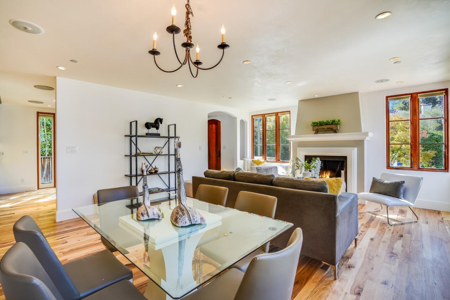 720 Edgewood Road San Mateo, CA 94402 - Photo 12 of 56 a view of a dining room with furniture a chandelier and wooden floor