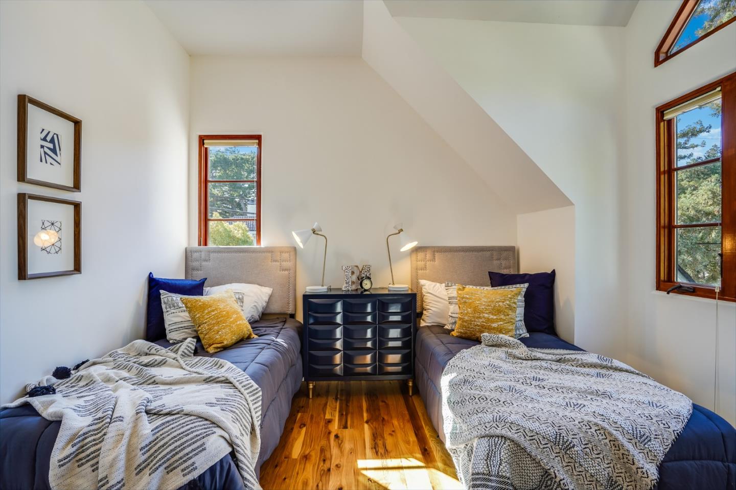 720 Edgewood Road San Mateo, CA 94402 - Photo 28 of 56 a bedroom with a bed and wooden floor