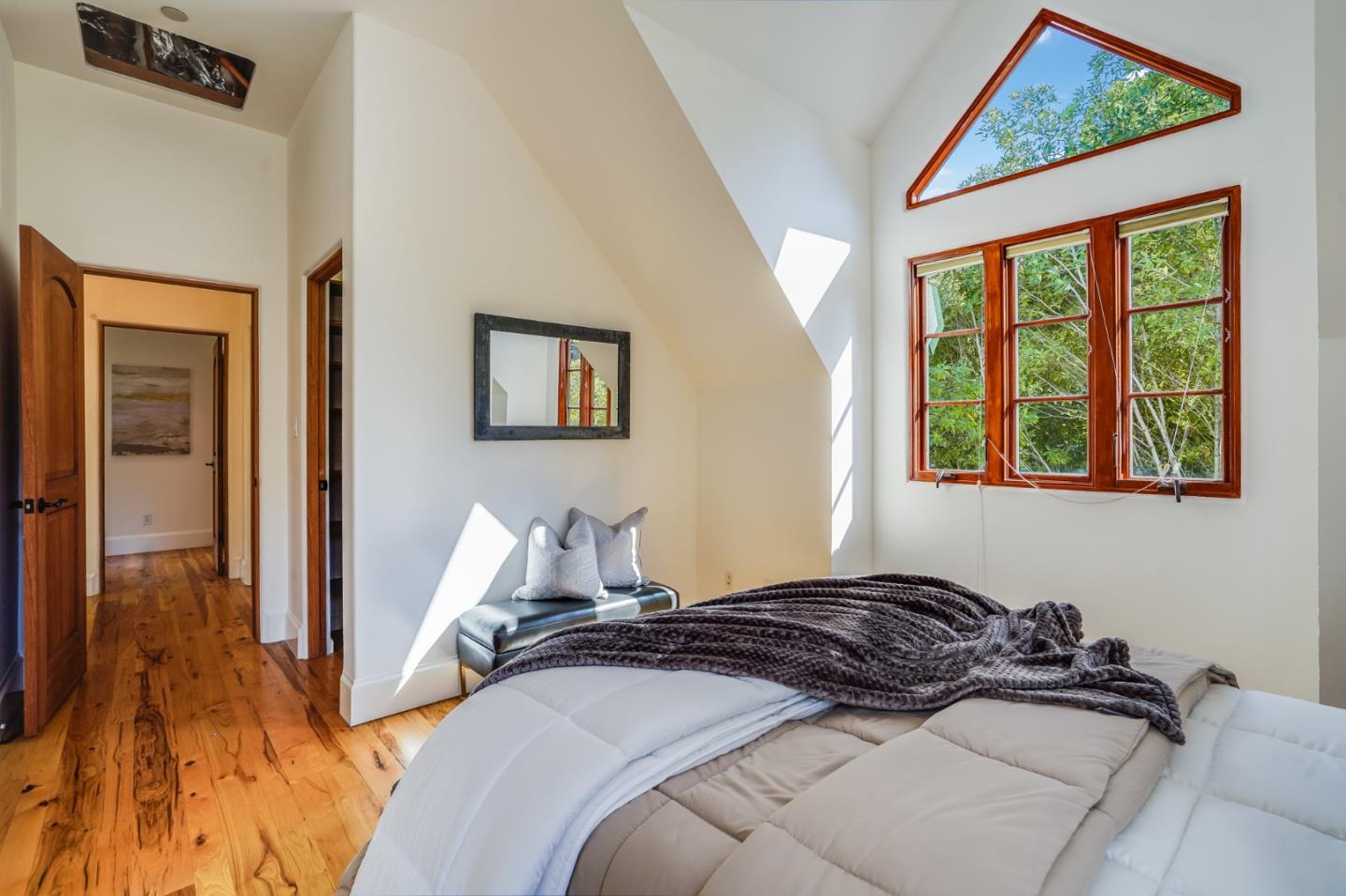 720 Edgewood Road San Mateo, CA 94402 - Photo 30 of 56 a bedroom with a bed and wooden floor