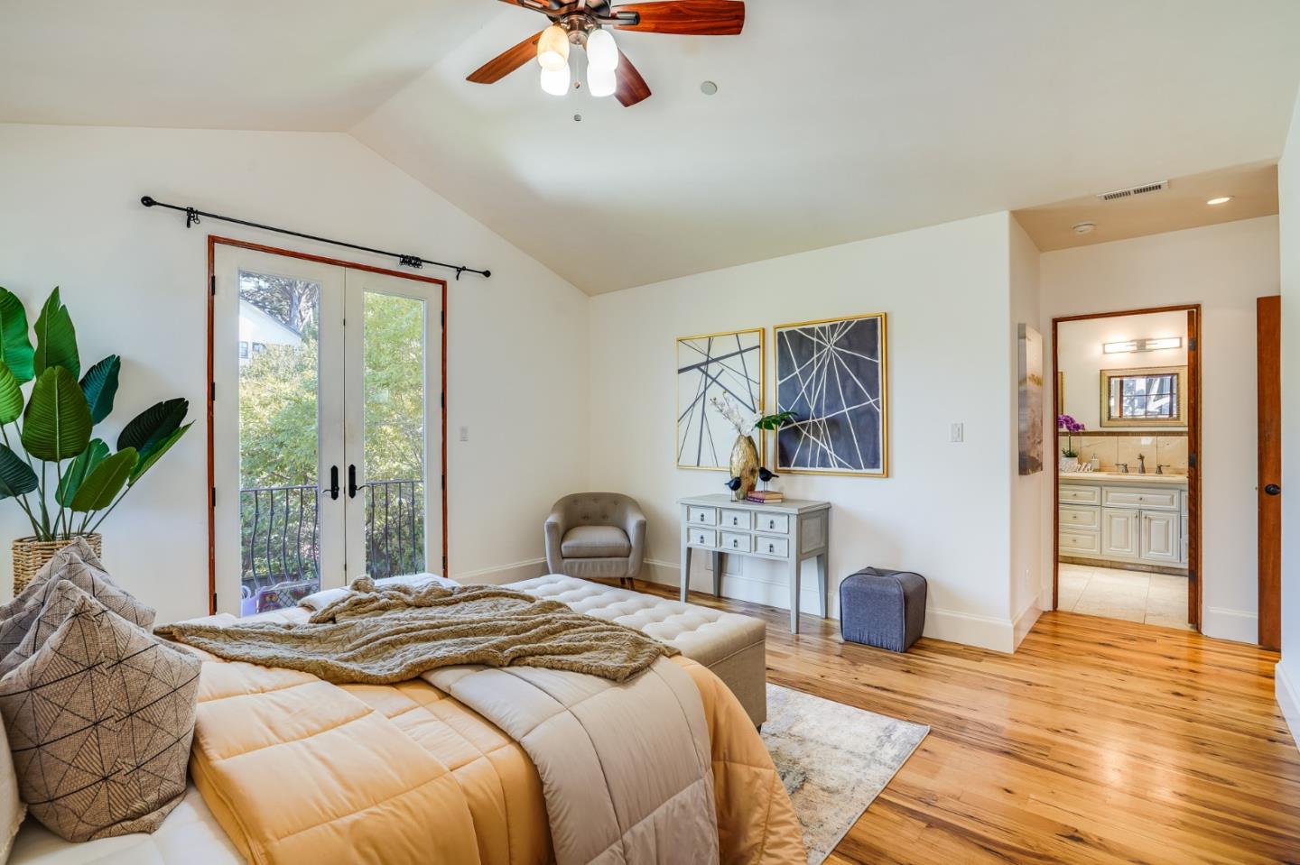 720 Edgewood Road San Mateo, CA 94402 - Photo 33 of 56 a bedroom with a large bed and a chandelier