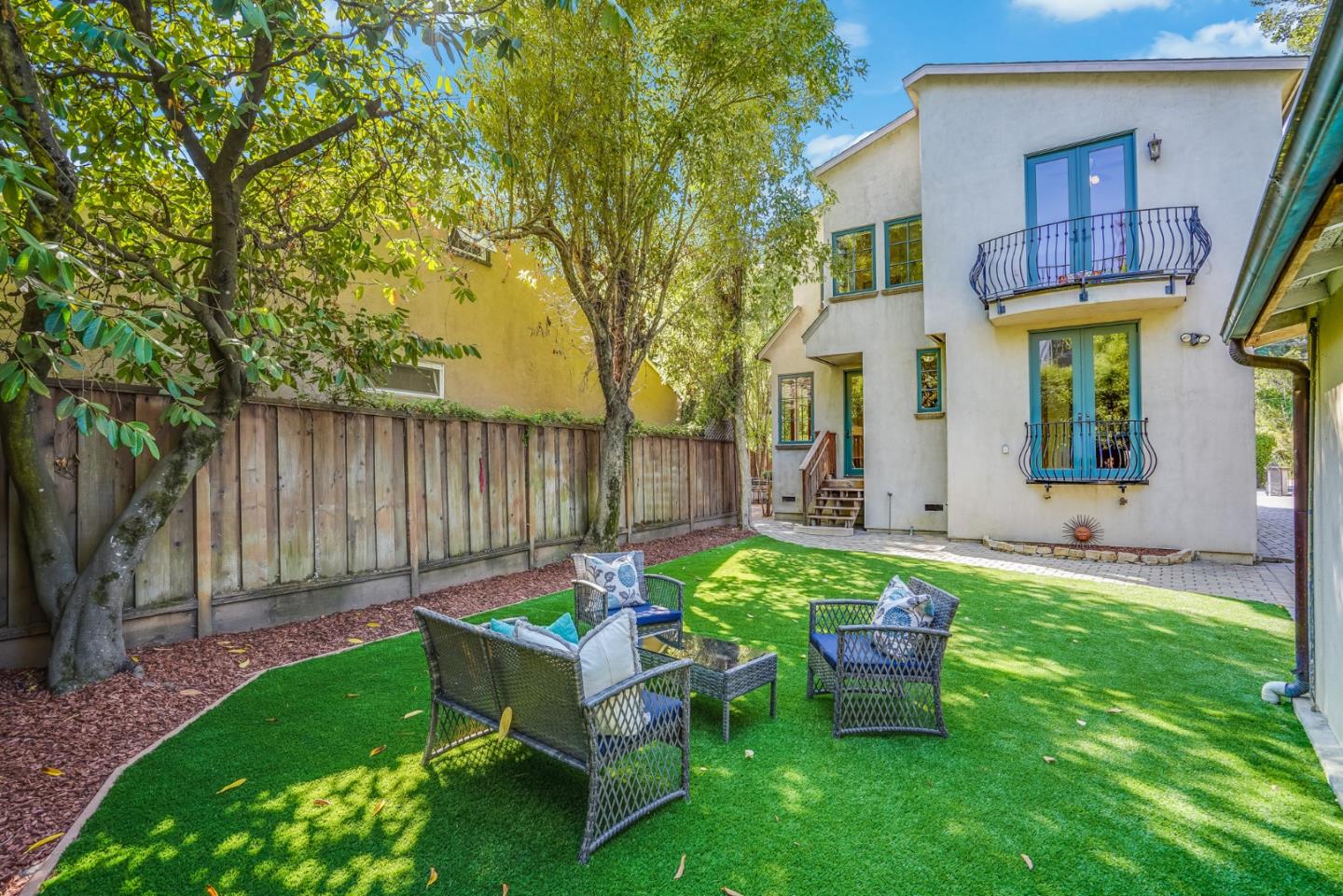 720 Edgewood Road San Mateo, CA 94402 - Photo 40 of 56 a view of a chair and table in backyard of the house