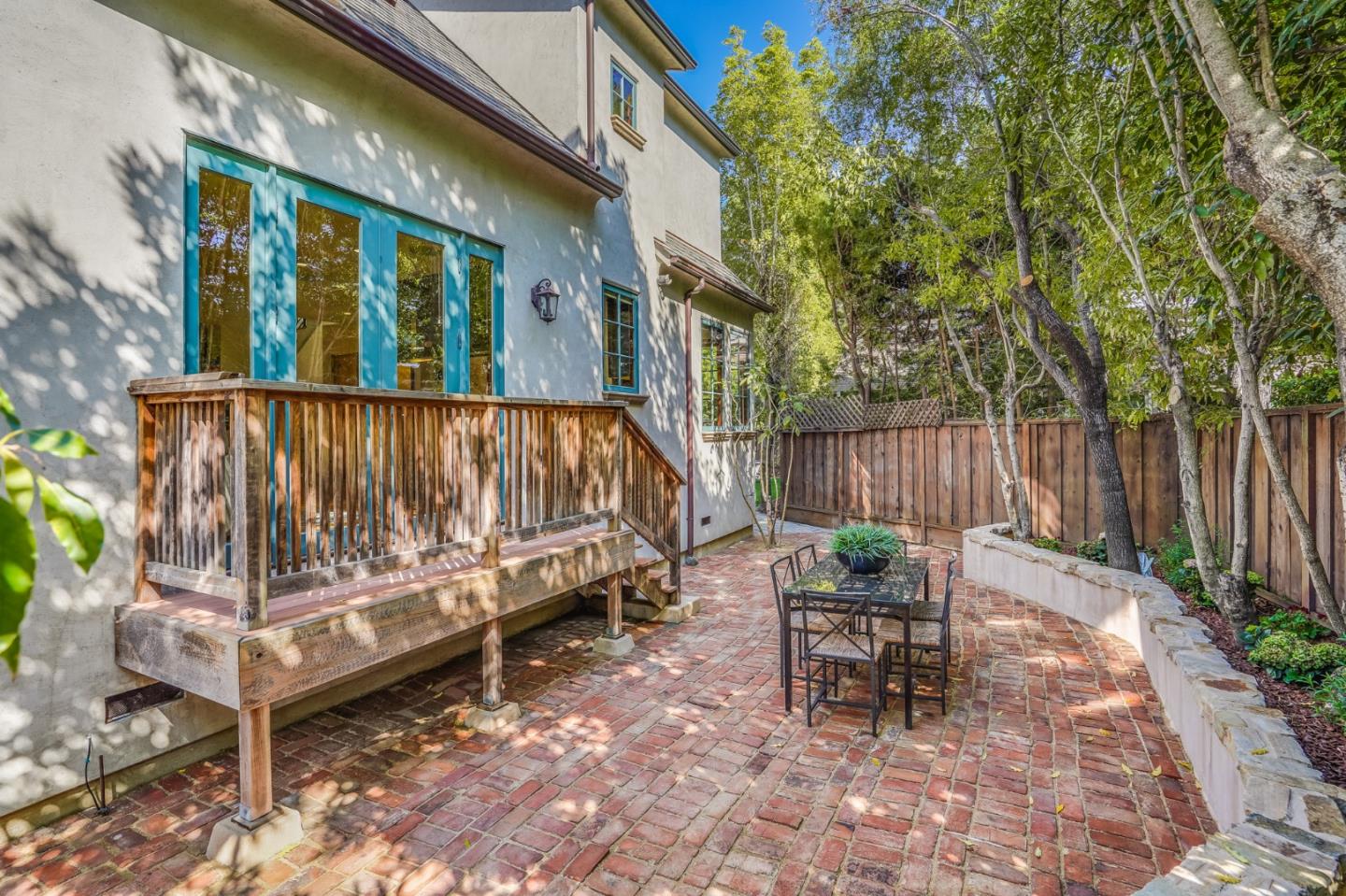 720 Edgewood Road San Mateo, CA 94402 - Photo 52 of 56 a view of a chairs setting in the backyard of a house