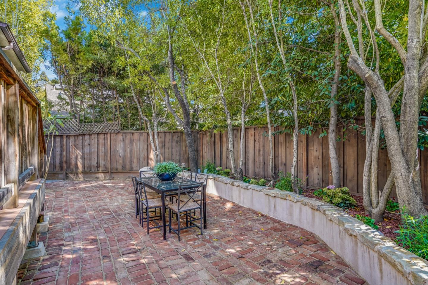 720 Edgewood Road San Mateo, CA 94402 - Photo 54 of 56 a backyard of a house with yard and outdoor seating