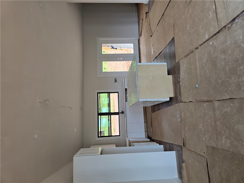 157 Hunting Hollow Road Six Mile, SC 29682 - Photo 17 of 19 A well-lit kitchen space, currently under construction, provides a view of future indoor-outdoor living.