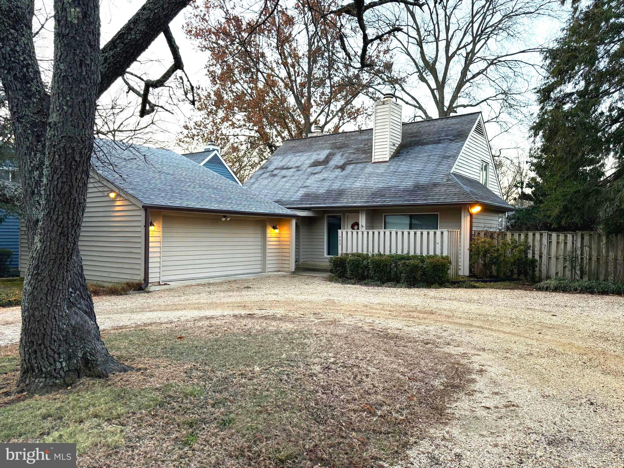 1403 Corey Lane Annapolis, MD 21401 - Photo 2 of 40 a front view of a house with a yard and garage