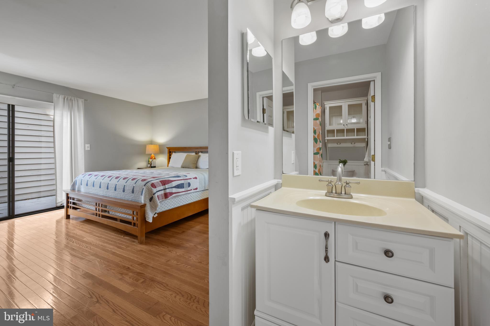 1403 Corey Lane Annapolis, MD 21401 - Photo 25 of 40 a bedroom with a bed and a dresser