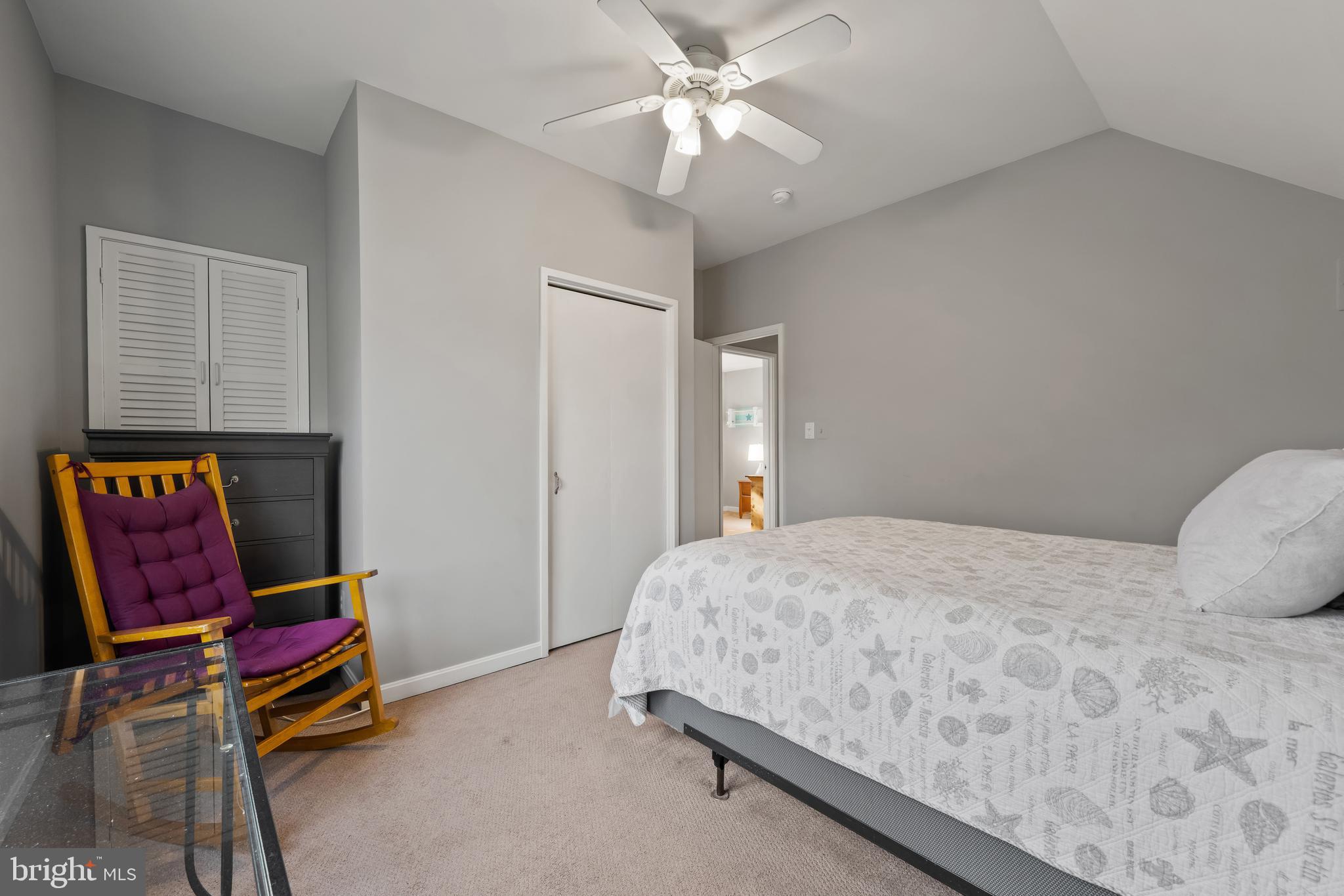 1403 Corey Lane Annapolis, MD 21401 - Photo 28 of 40 a bedroom with a bed and a chandelier