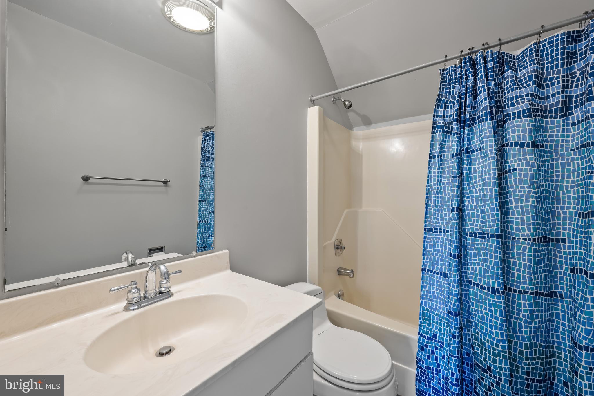 1403 Corey Lane Annapolis, MD 21401 - Photo 29 of 40 a bathroom with a sink a toilet and shower