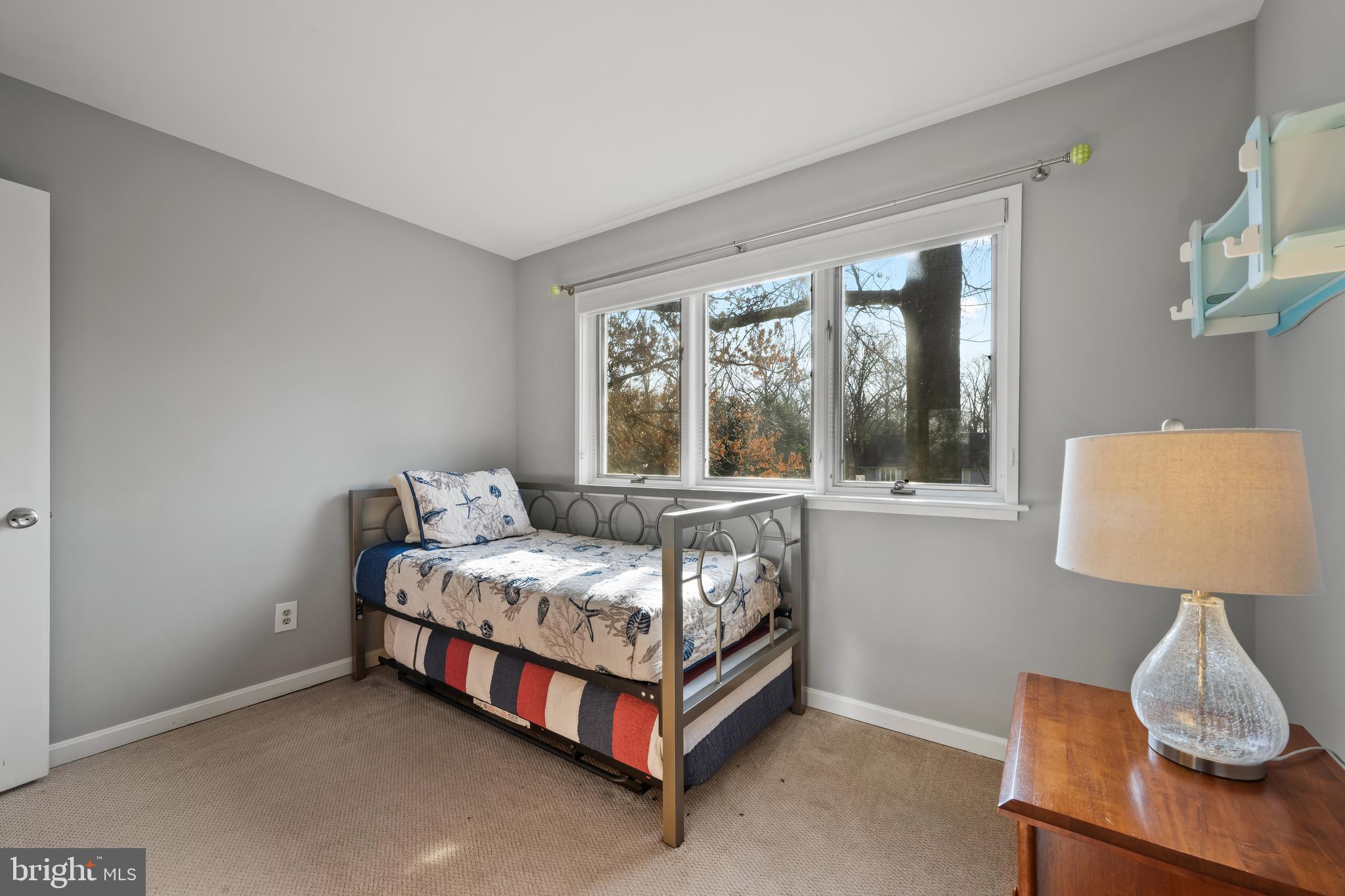 1403 Corey Lane Annapolis, MD 21401 - Photo 31 of 40 a bed sitting in a bedroom next to a window