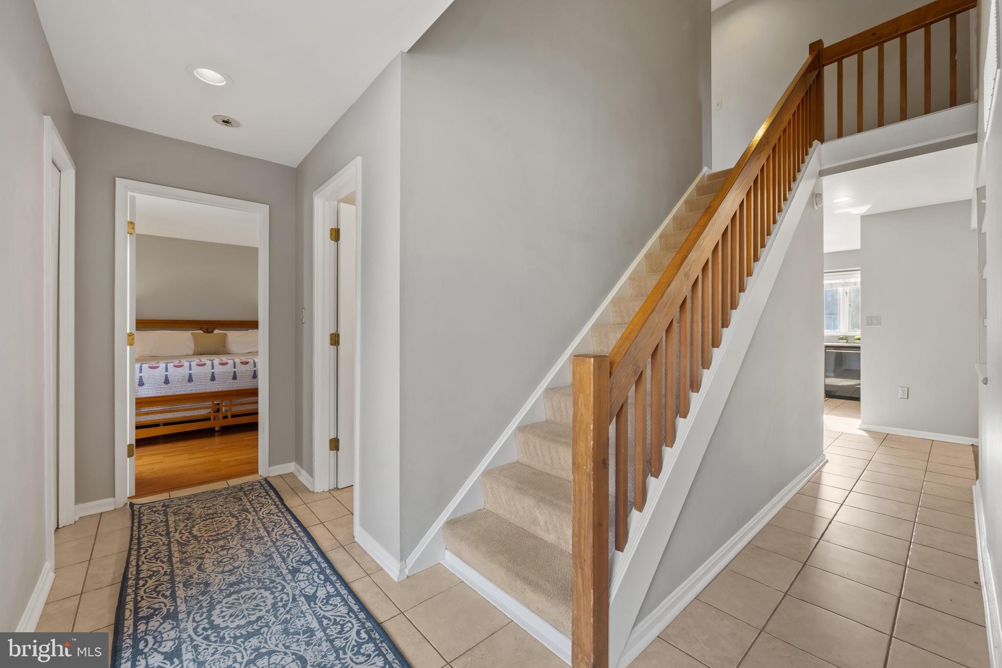 1403 Corey Lane Annapolis, MD 21401 - Photo 5 of 40 a view of a hallway with wooden floor and staircase