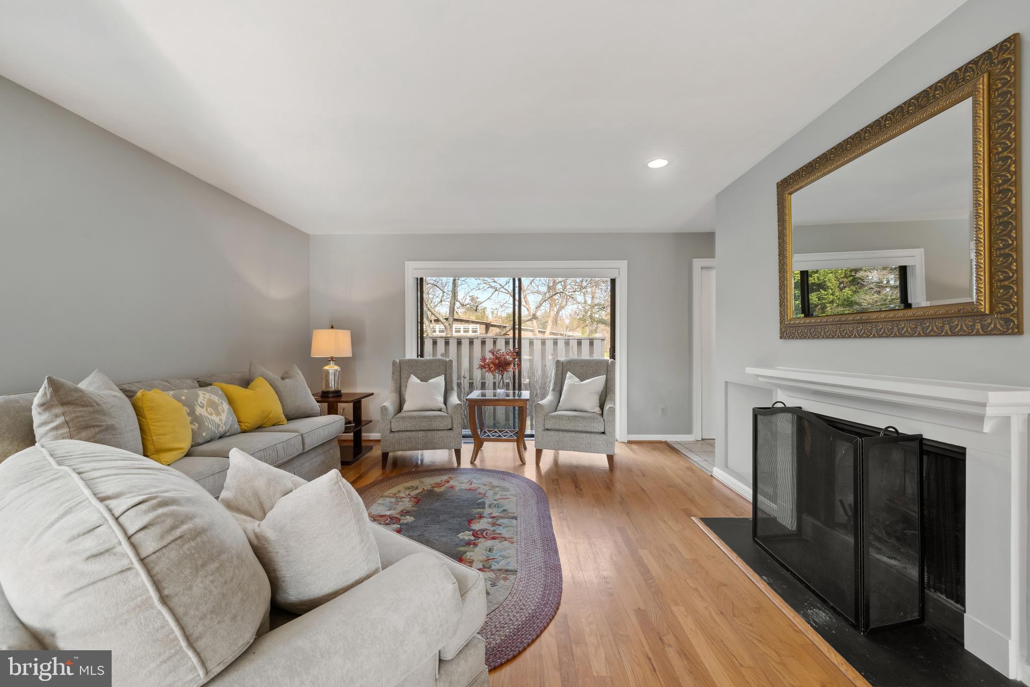 1403 Corey Lane Annapolis, MD 21401 - Photo 8 of 40 a living room with furniture and a fireplace
