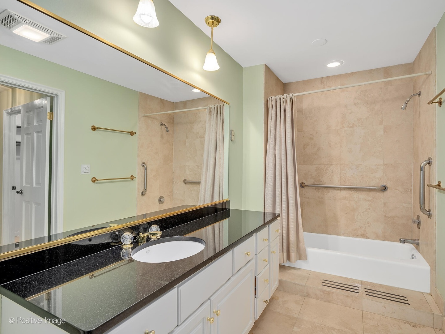1401 Burr Oak Road, Unit 202B Hinsdale, IL 60521 - Photo 28 of 40 a bathroom with a granite countertop sink mirror and a bathtub