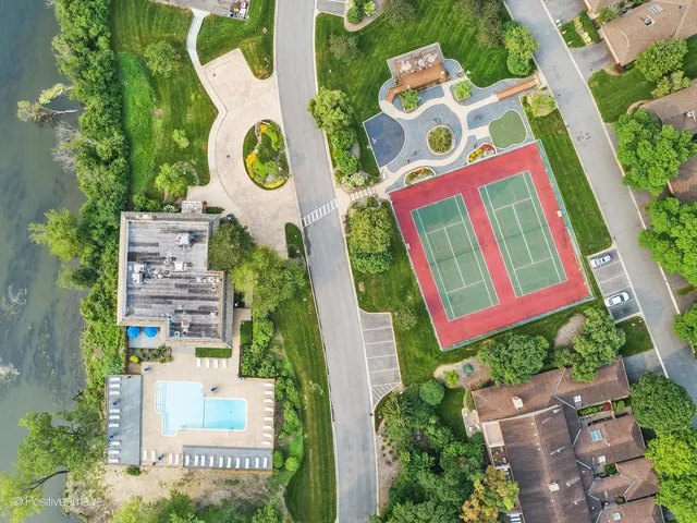 a view of a swimming pool with an outdoor seating