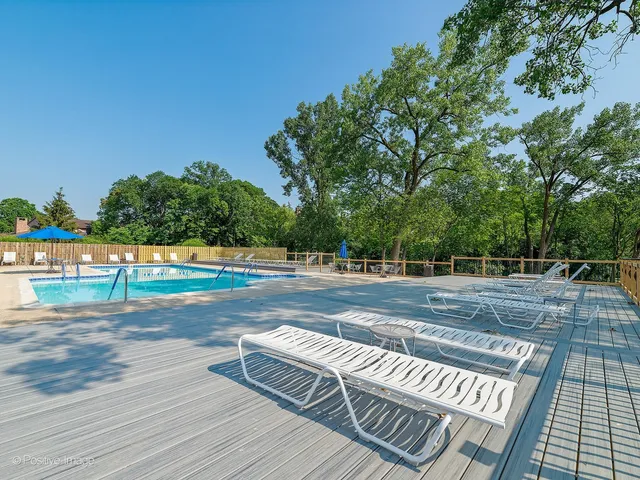 a view of deck with chairs and wooden floor