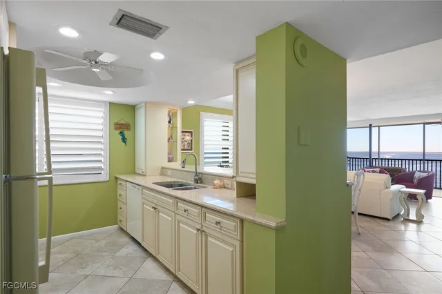 a kitchen with a sink and a stove top oven