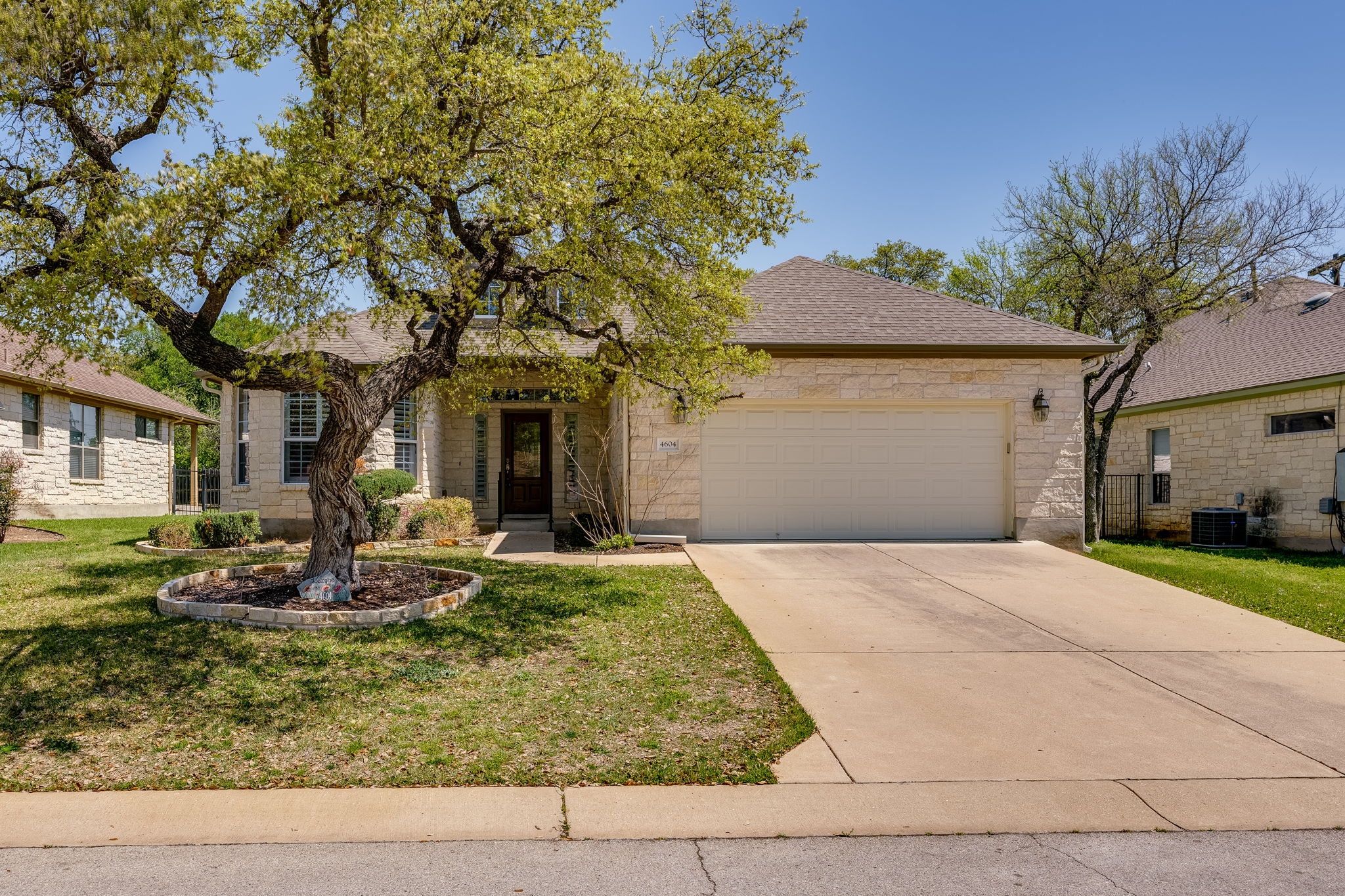 4604 Sonora Trace Georgetown, TX 78633 - Photo 1 of 1 a front view of a house with garden