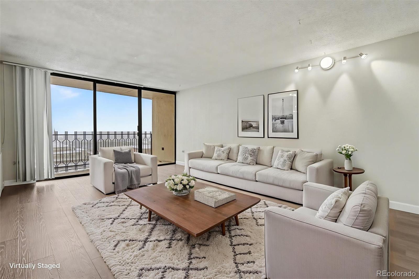 1020 15th Street, Unit 13N Denver, CO 80202 - Photo 1 of 12 a living room with furniture and a large window