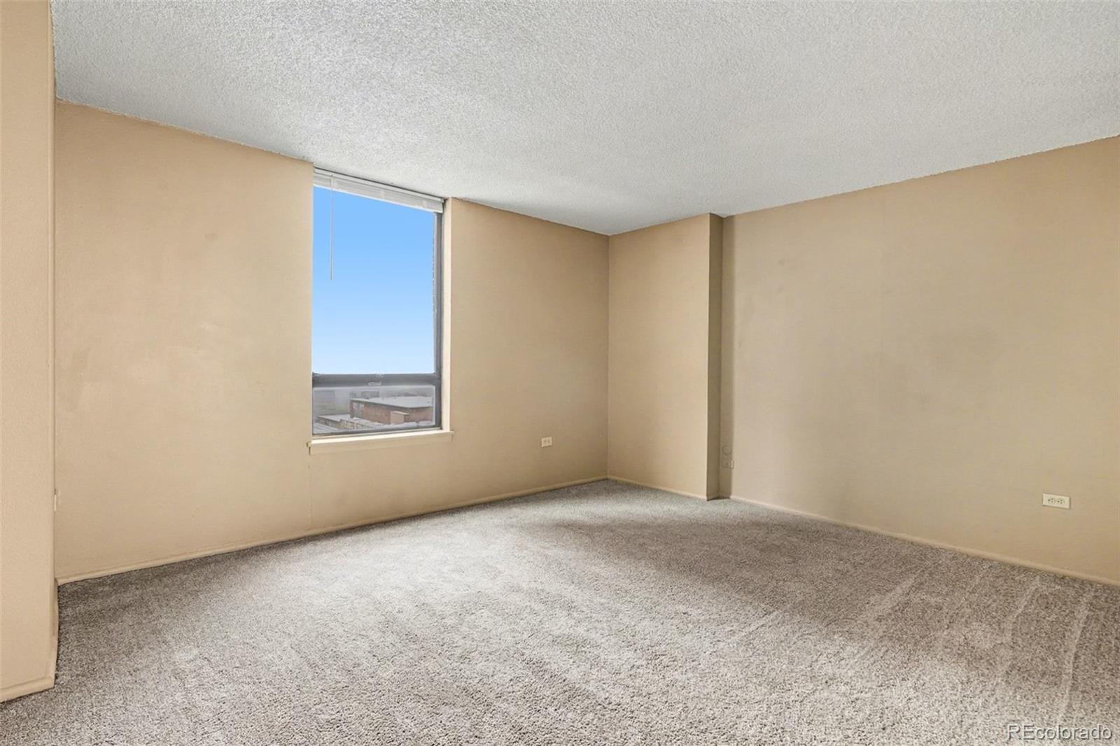 1020 15th Street, Unit 13N Denver, CO 80202 - Photo 7 of 12 a view of an empty room with a window