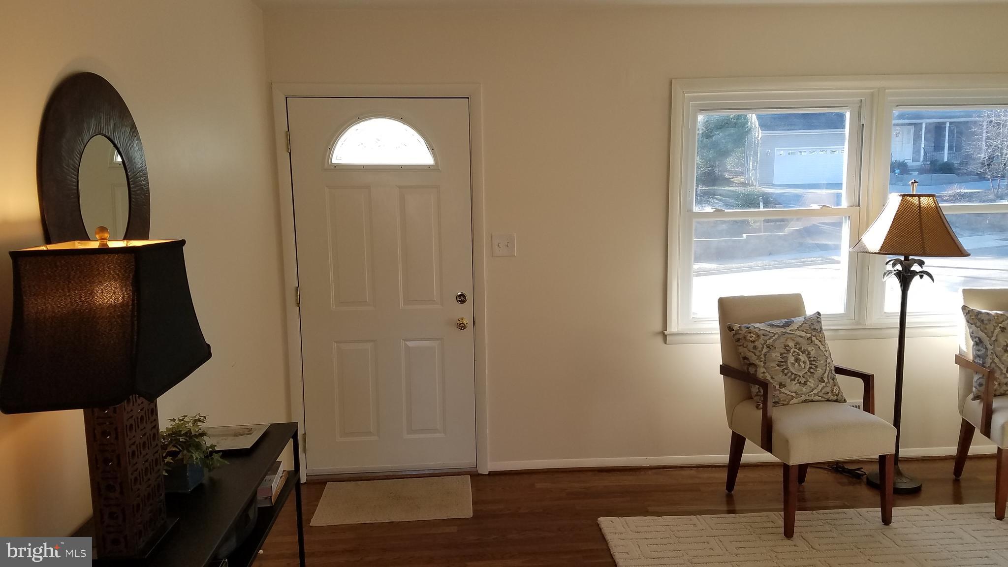 Living room  hallway and front door
