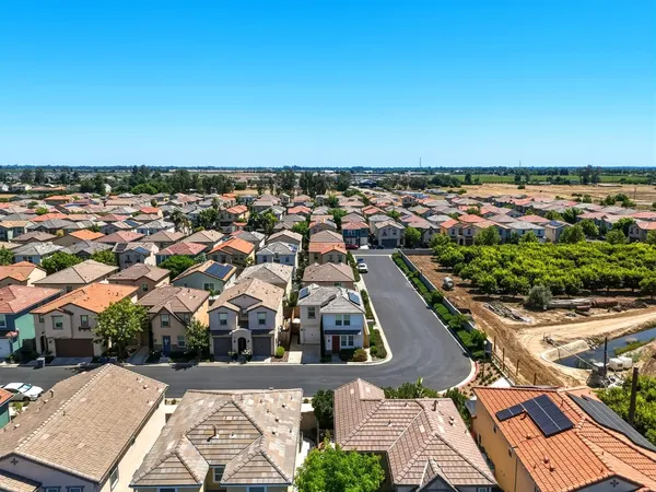 an aerial view of a house with a lake view