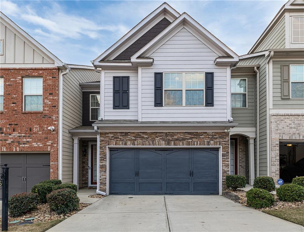 a front view of a house with yard