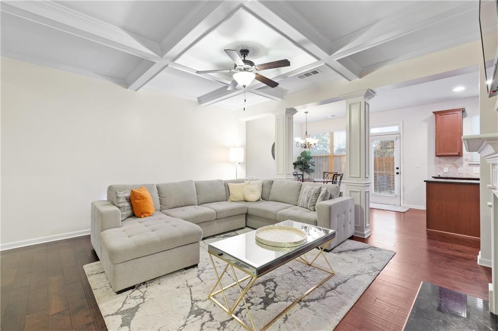5715 Radford Loop Fairburn, GA 30213 - Photo 13 of 26 a living room with furniture a ceiling fan and a rug