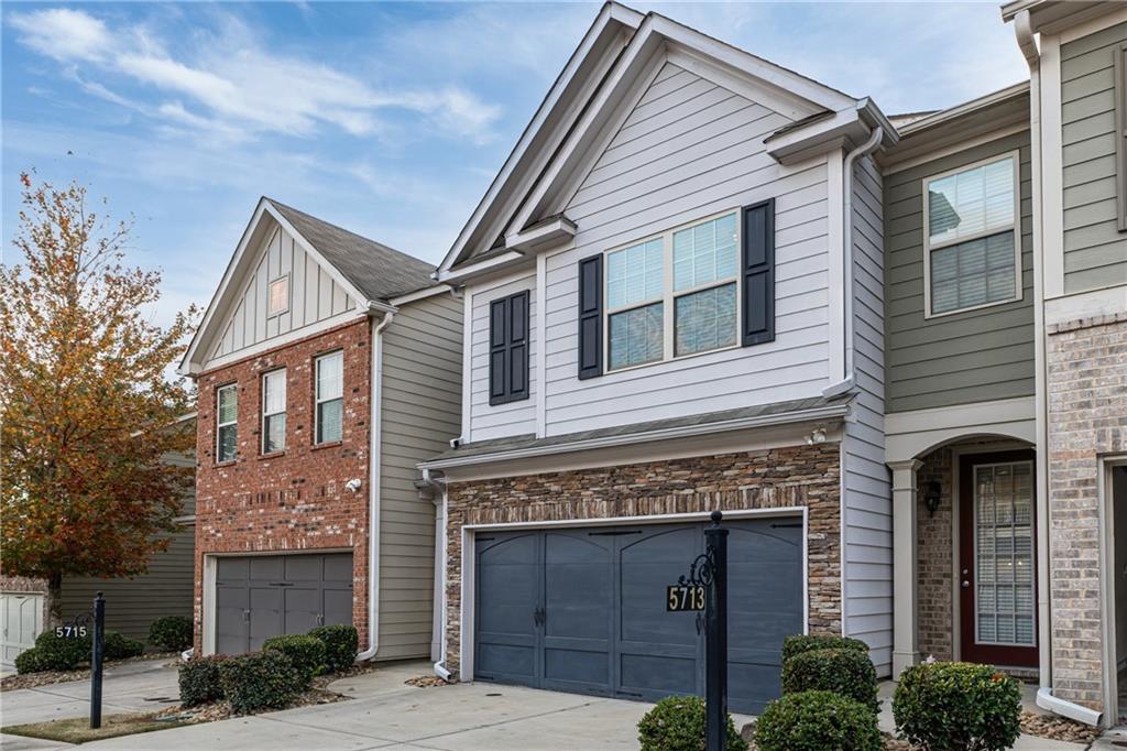 5715 Radford Loop Fairburn, GA 30213 - Photo 2 of 26 a front view of a house with yard