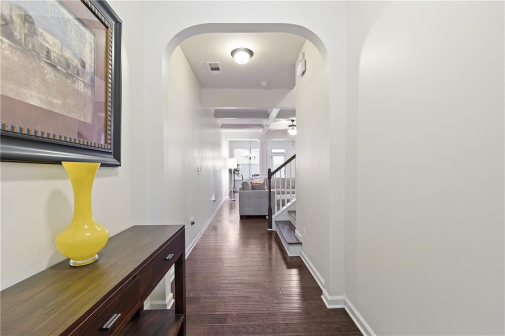 5715 Radford Loop Fairburn, GA 30213 - Photo 4 of 26 a view of a hallway with wooden floor and furniture