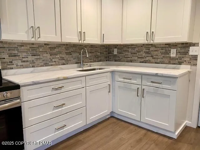 a view of a kitchen with cabinets