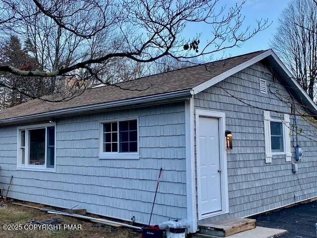 a view of a house with a tree