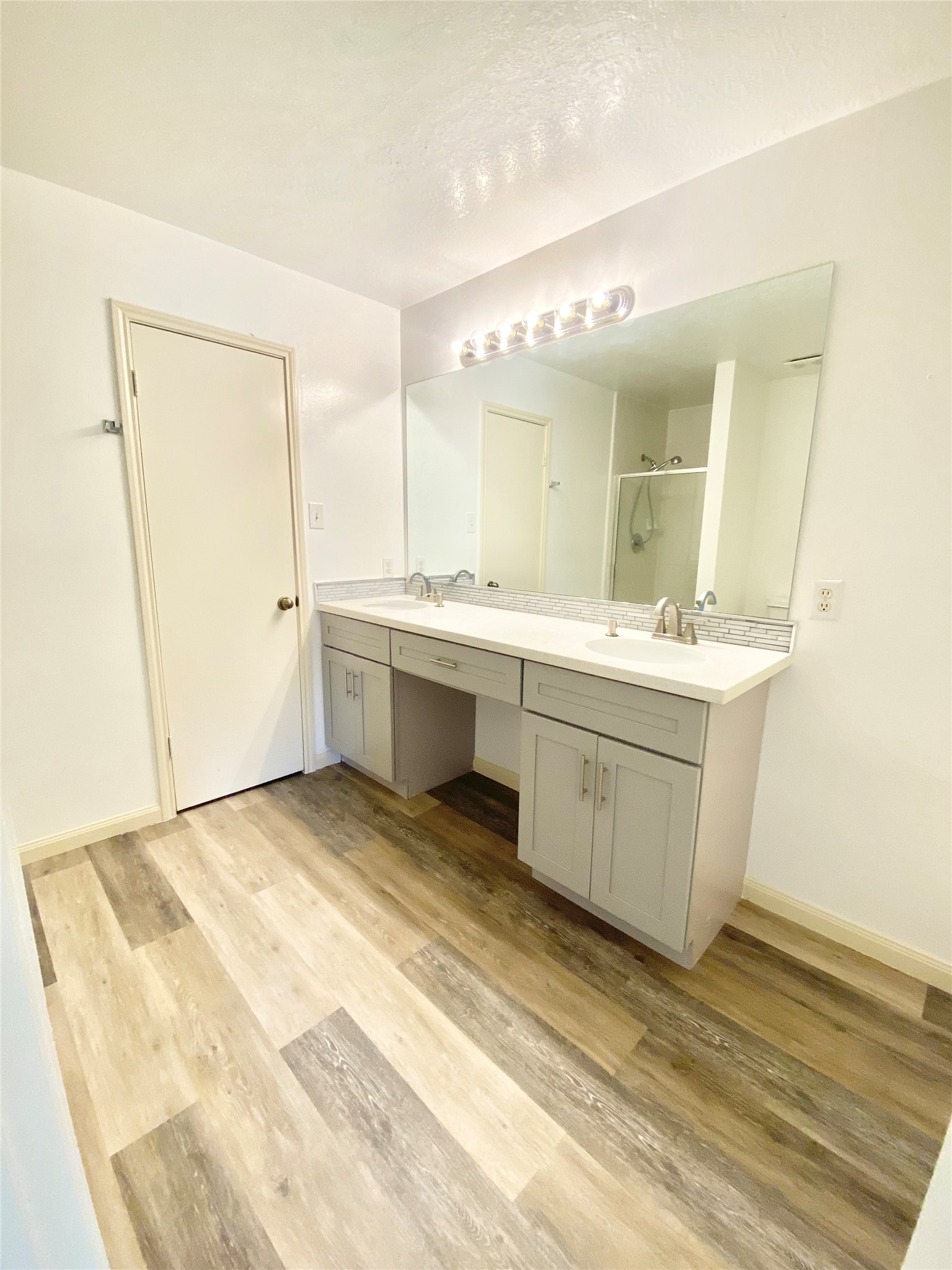 4203 Breckenridge Drive Houston, TX 77066 - Photo 16 of 43 a view of a bathroom with a sink and mirror
