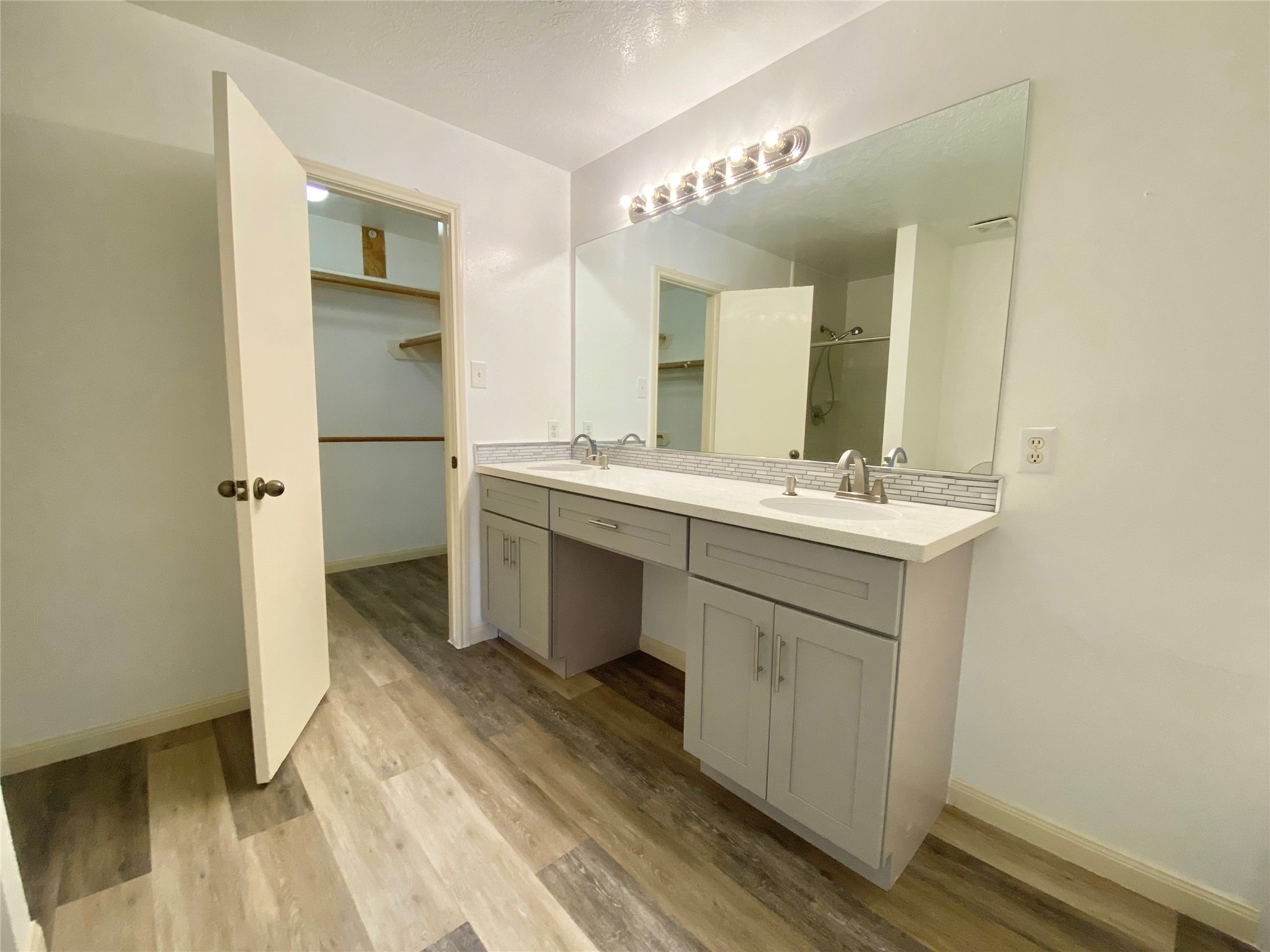 4203 Breckenridge Drive Houston, TX 77066 - Photo 19 of 43 a bathroom with a sink a mirror and a shower