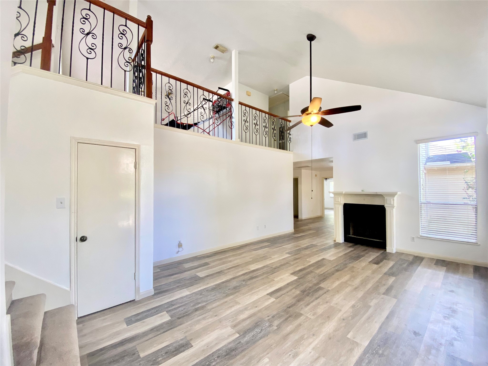 4203 Breckenridge Drive Houston, TX 77066 - Photo 30 of 43 a view of a livingroom with furniture a fireplace and wooden floor