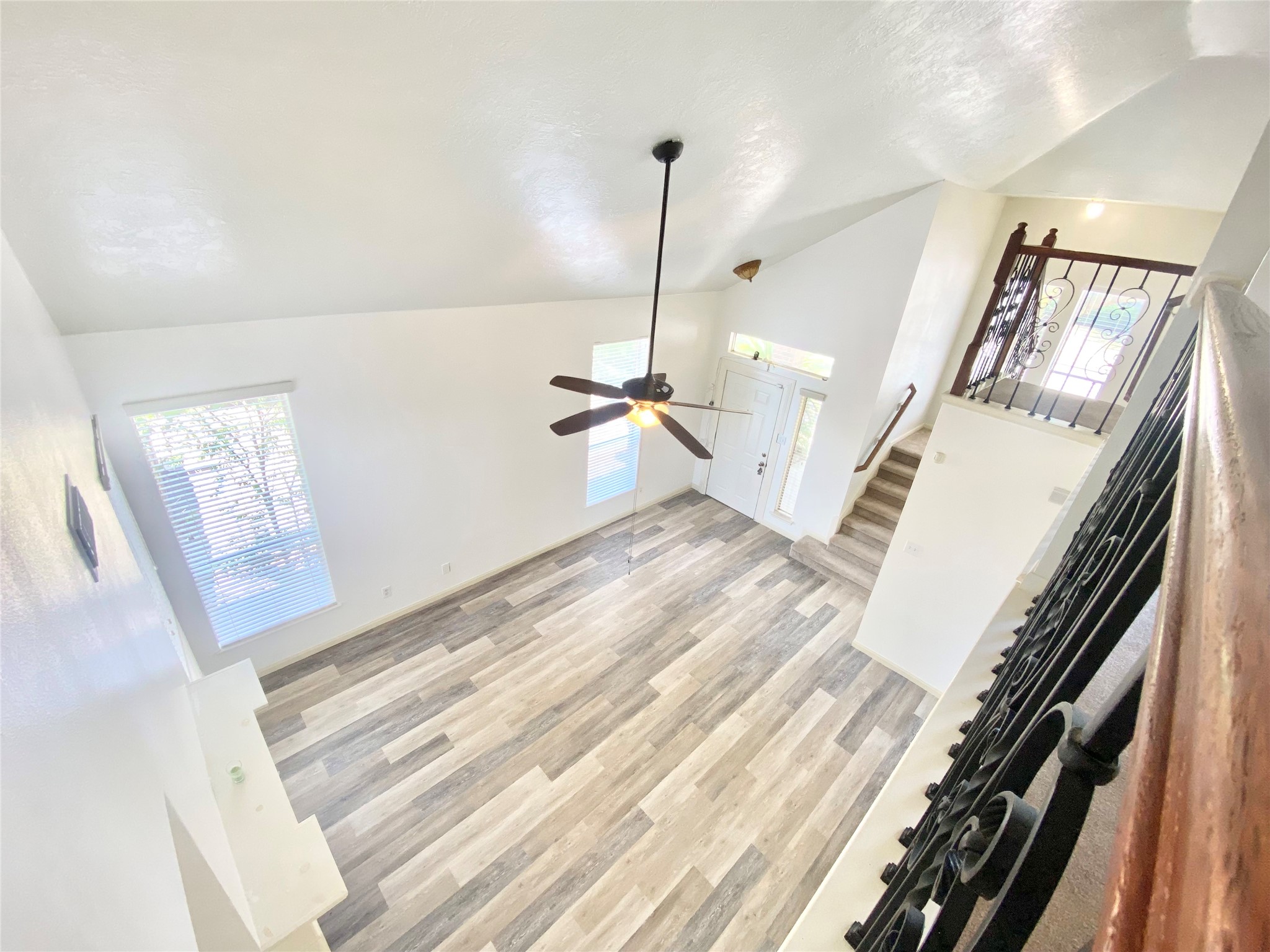 4203 Breckenridge Drive Houston, TX 77066 - Photo 32 of 43 a view of a livingroom with wooden floor and stairs