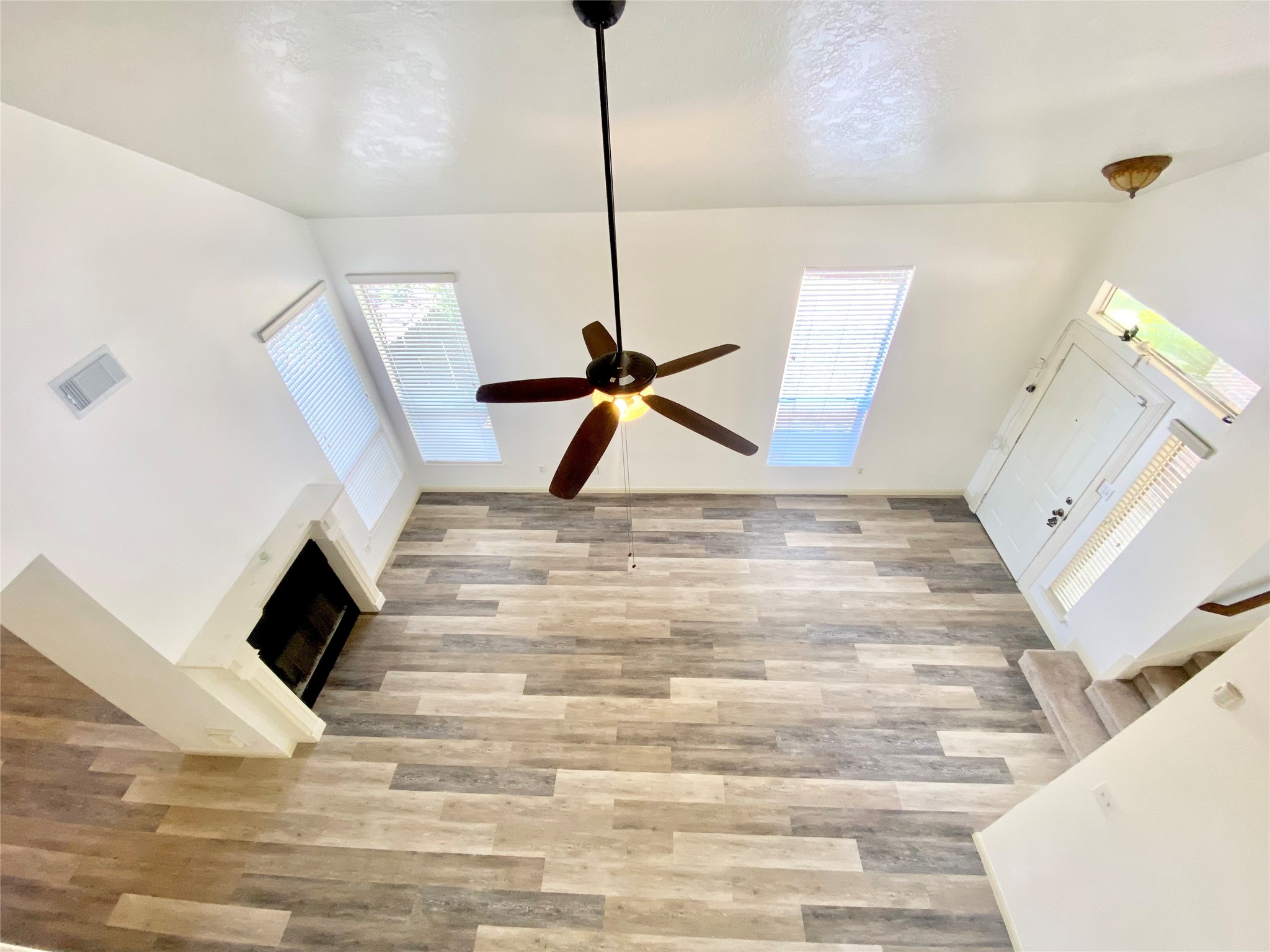 4203 Breckenridge Drive Houston, TX 77066 - Photo 33 of 43 a view of empty room with wooden floor and ceiling fan