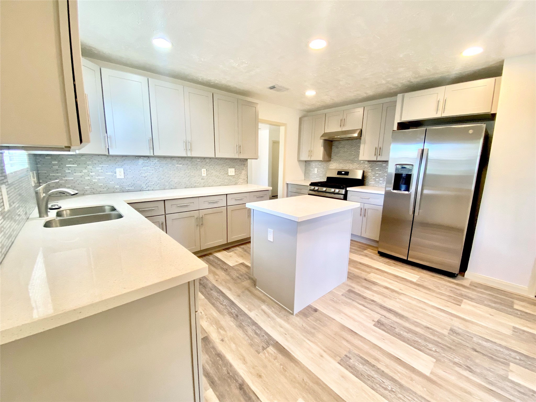 4203 Breckenridge Drive Houston, TX 77066 - Photo 5 of 43 a kitchen with a sink a counter top space stainless steel appliances and cabinets