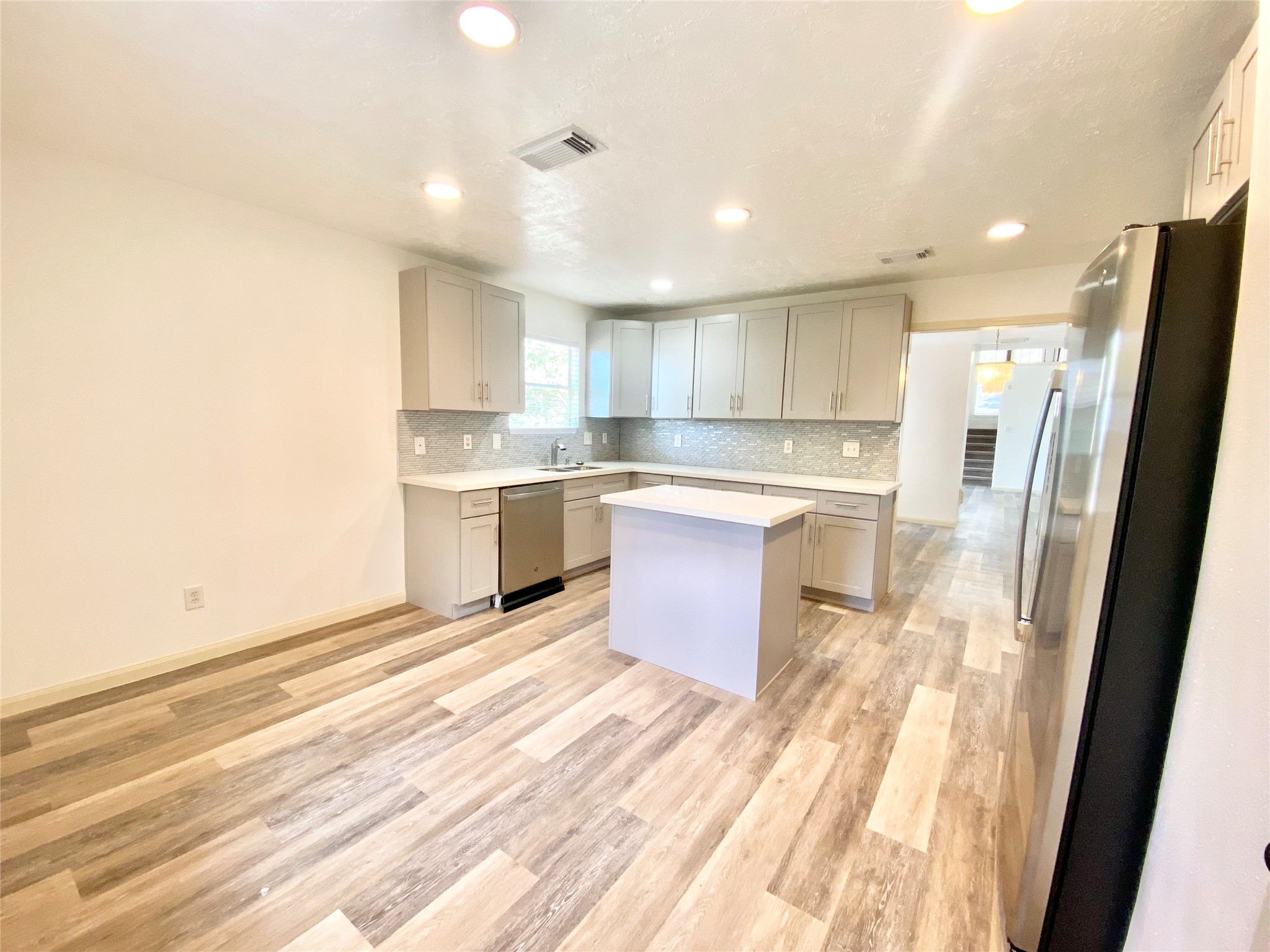 4203 Breckenridge Drive Houston, TX 77066 - Photo 7 of 43 a kitchen with stainless steel appliances granite countertop a refrigerator and a stove top oven