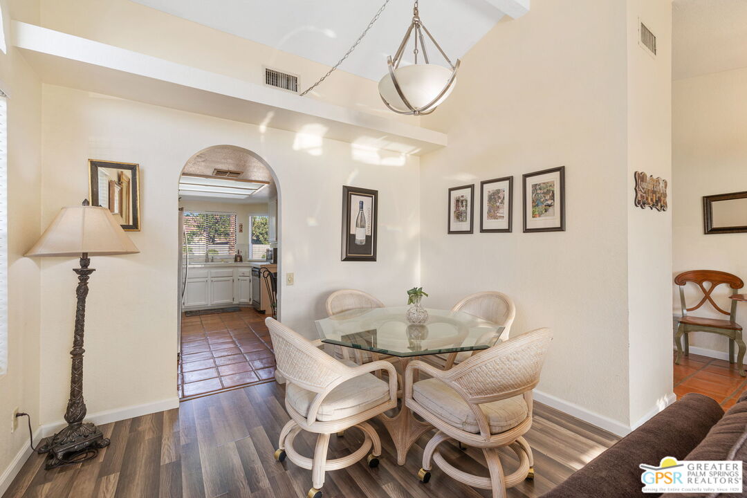 45688 Sutter Creek Road Indio, CA 92201 - Photo 11 of 51 a view of a dining room with furniture and wooden floor