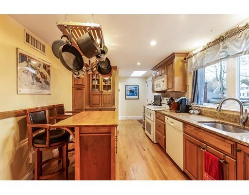 37 Arapahoe Road Newton, MA 02465 - Photo 11 of 30 a kitchen with stainless steel appliances granite countertop a sink a stove and a wooden cabinets