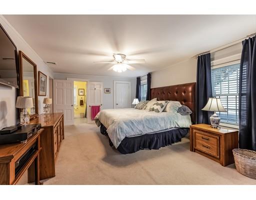 37 Arapahoe Road Newton, MA 02465 - Photo 17 of 30 a spacious bedroom with a bed window and flat screen tv