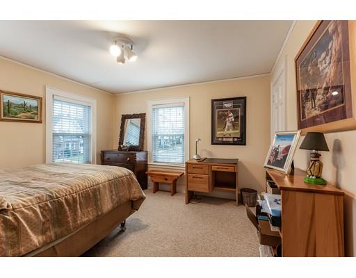 37 Arapahoe Road Newton, MA 02465 - Photo 21 of 30 a bedroom with a bed and wooden floor