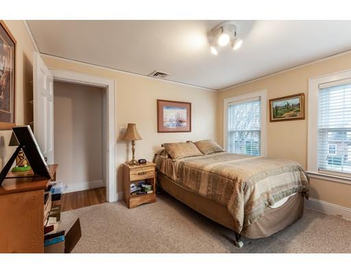 37 Arapahoe Road Newton, MA 02465 - Photo 22 of 30 a spacious bedroom with a bed and a window
