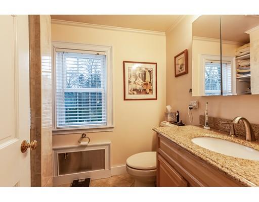 37 Arapahoe Road Newton, MA 02465 - Photo 24 of 30 a bathroom with a granite countertop sink mirror vanity and toilet