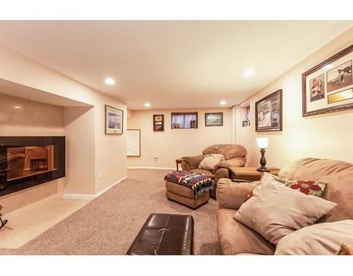 37 Arapahoe Road Newton, MA 02465 - Photo 27 of 30 a bedroom with furniture and a fireplace