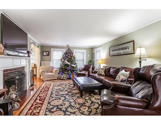 37 Arapahoe Road Newton, MA 02465 - Photo 6 of 30 a living room with furniture a flat screen tv and a fireplace