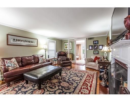 37 Arapahoe Road Newton, MA 02465 - Photo 7 of 30 a living room with furniture and a fireplace