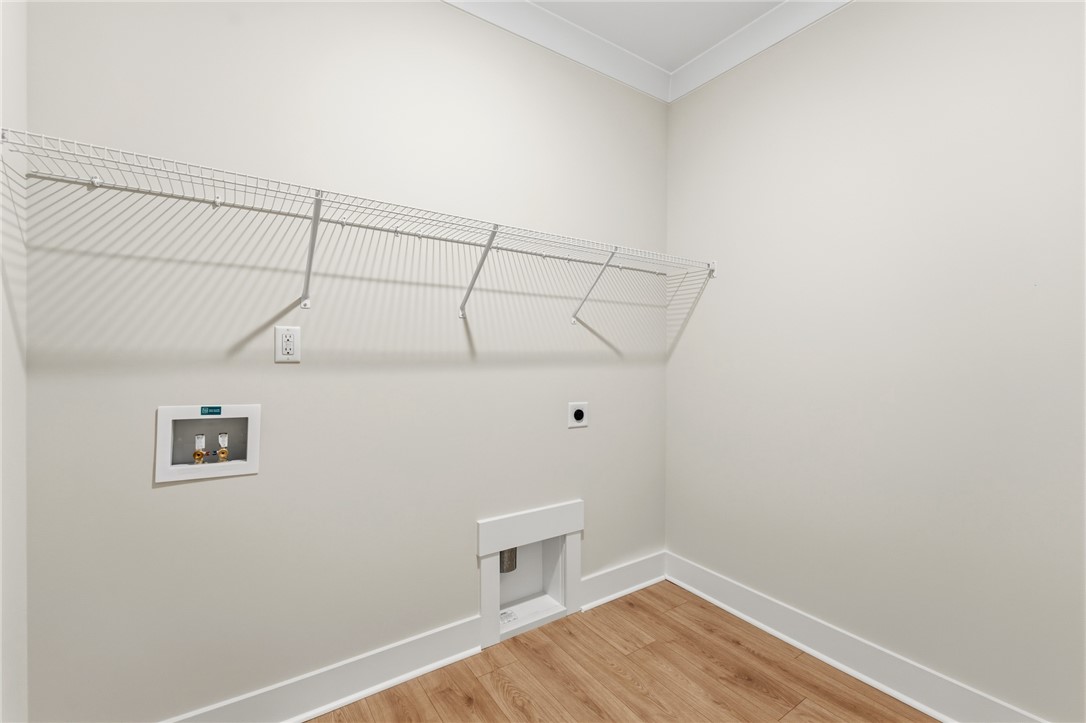 203 Timothy Court Anderson, SC 29621 - Photo 11 of 40 Ready for your appliances, this dedicated laundry space offers convenience and functional wire shelving.
